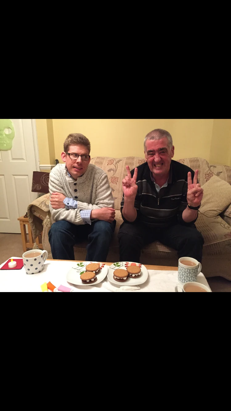 Two people showing food they have prepared