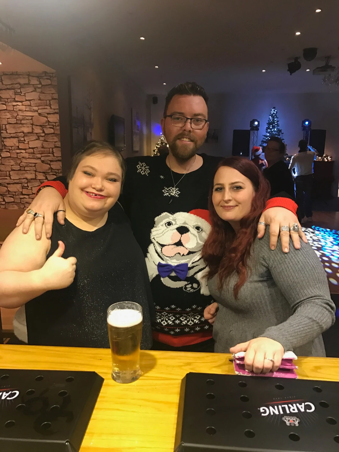 Friends posing together at a celebration
