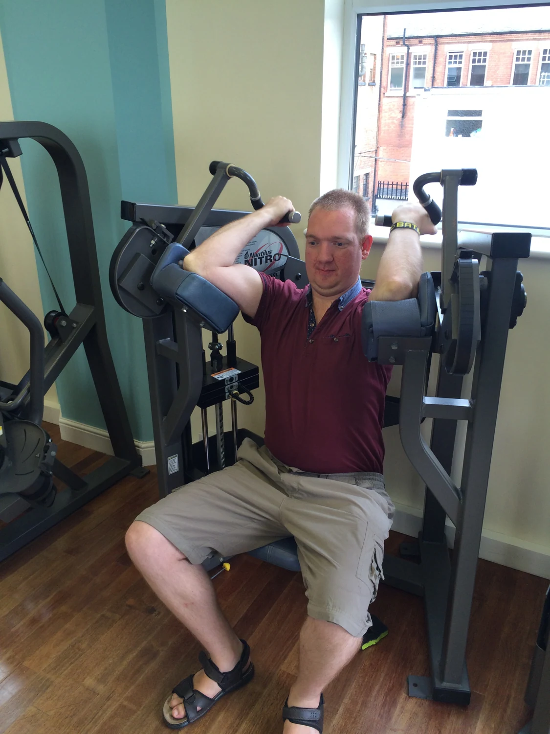 A man using exercise equipment in a gym