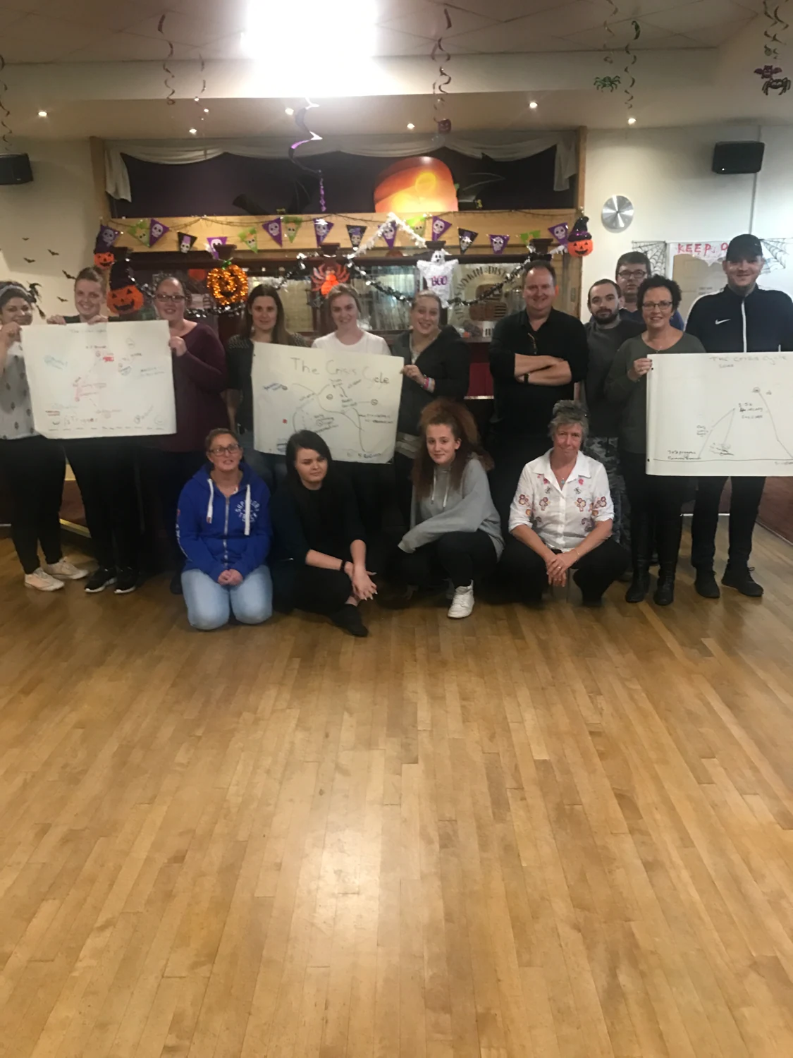 A group showing posters after an activity session