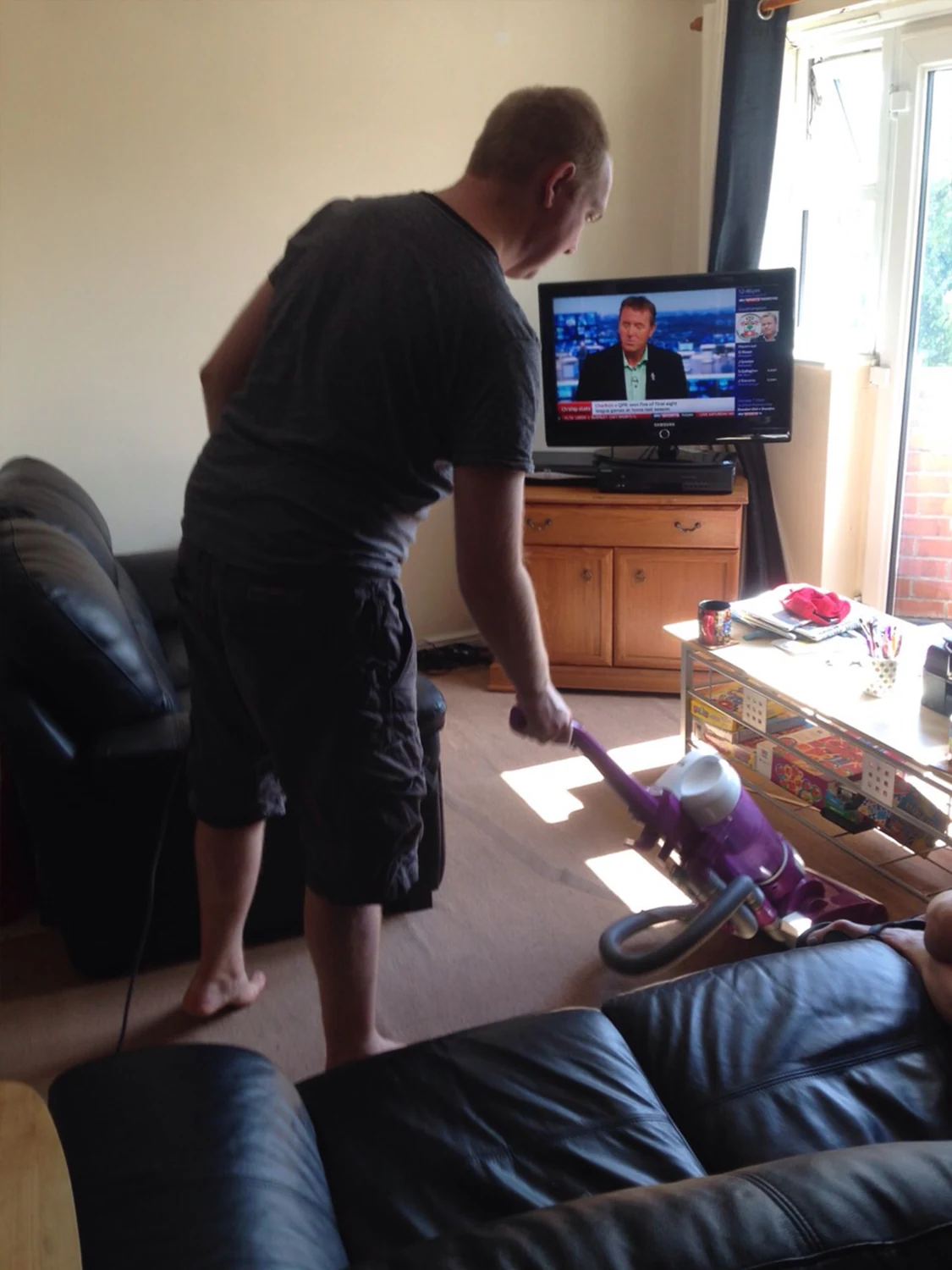 A man using a television-based activity at home