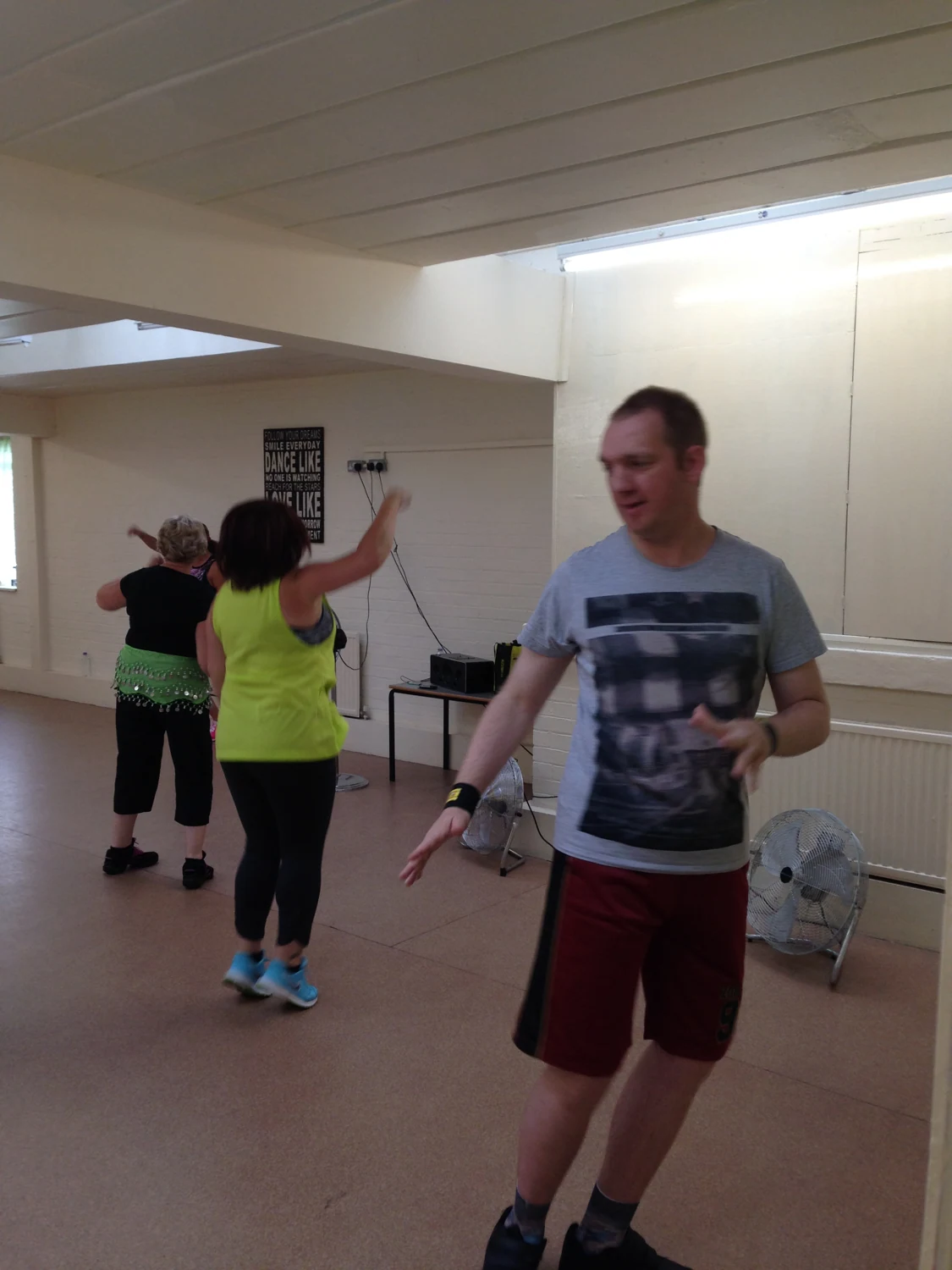 People taking part in an indoor exercise session