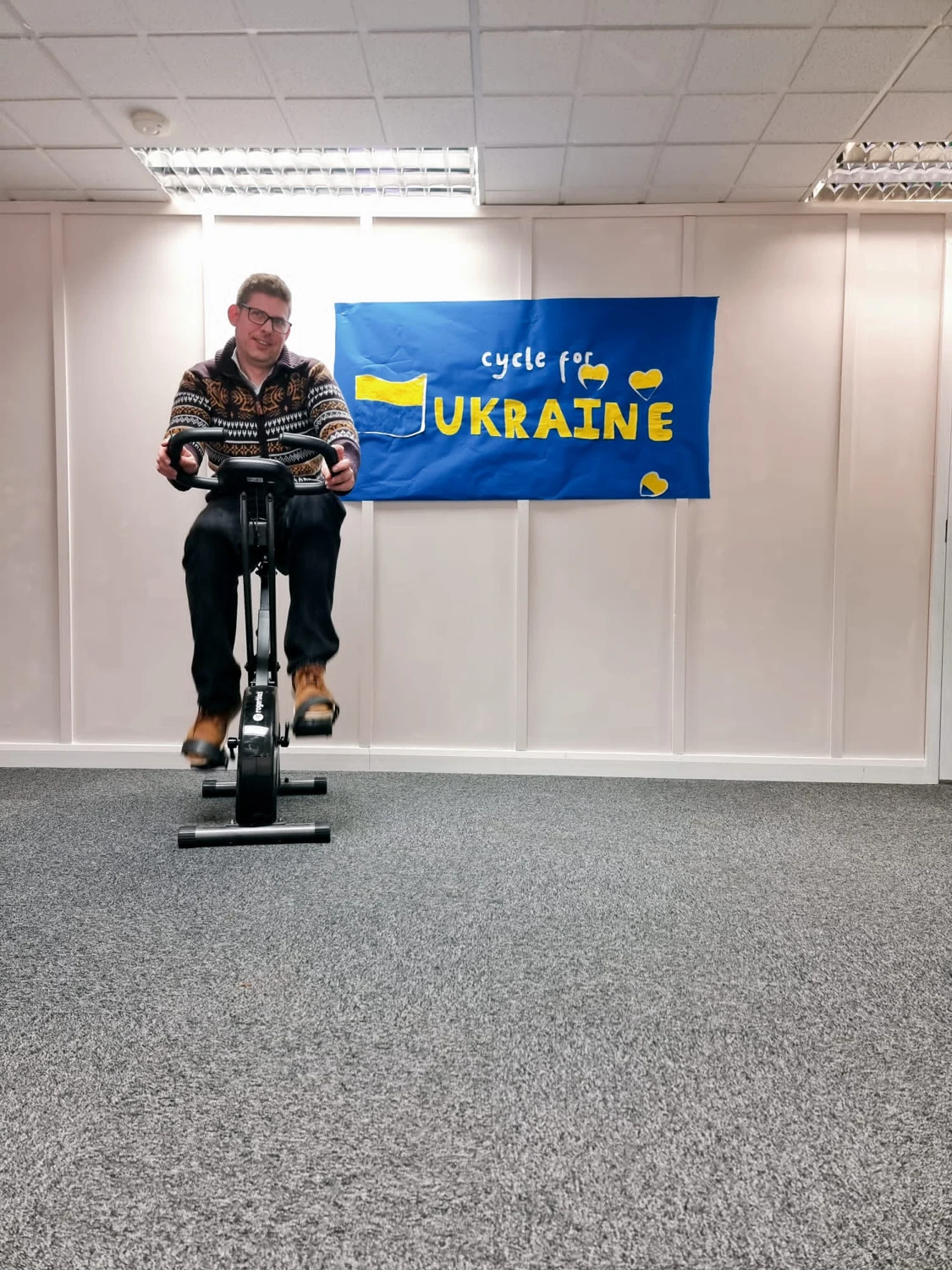 A man using a vibration exercise platform