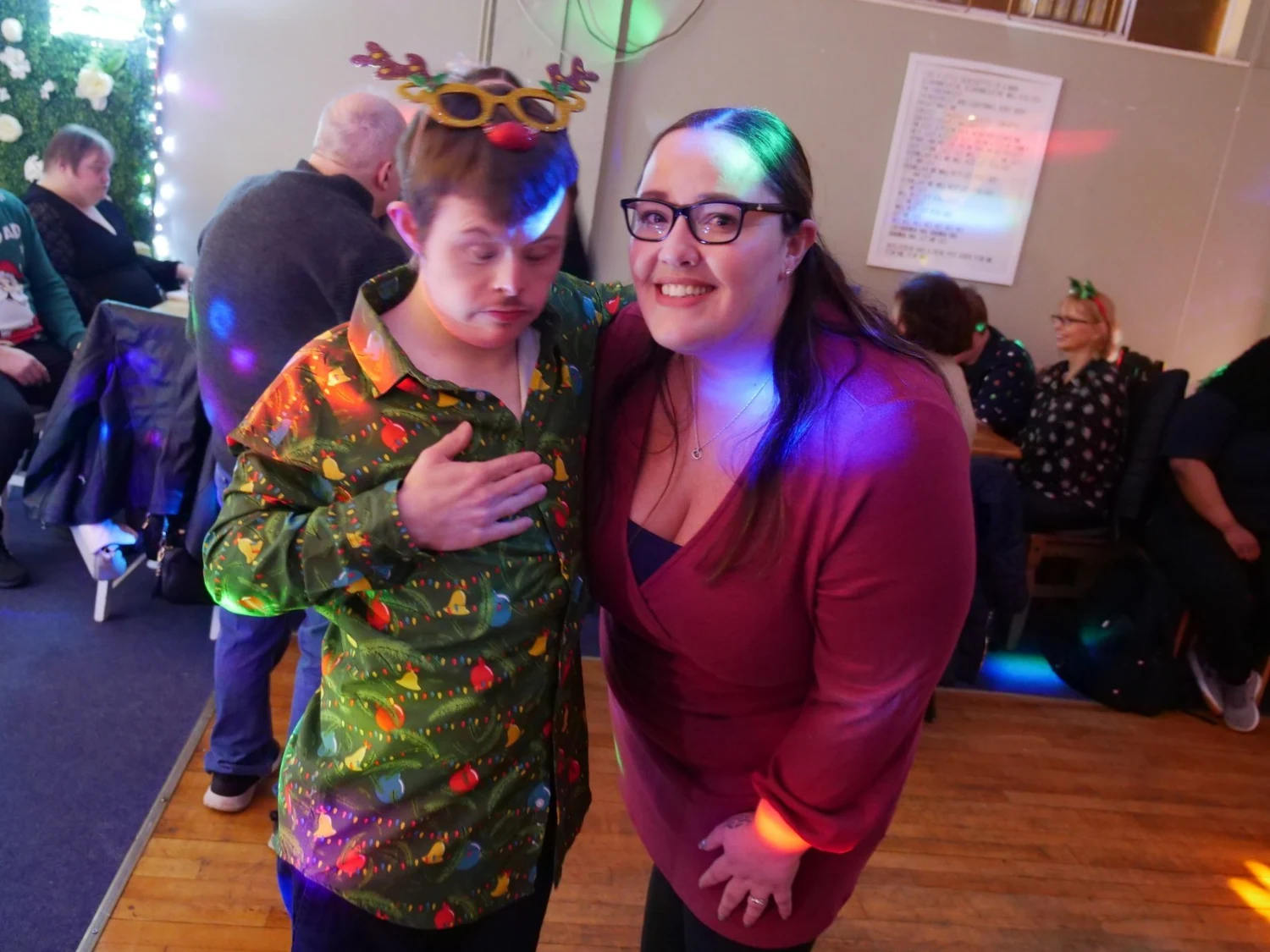Two women celebrating together in party glasses