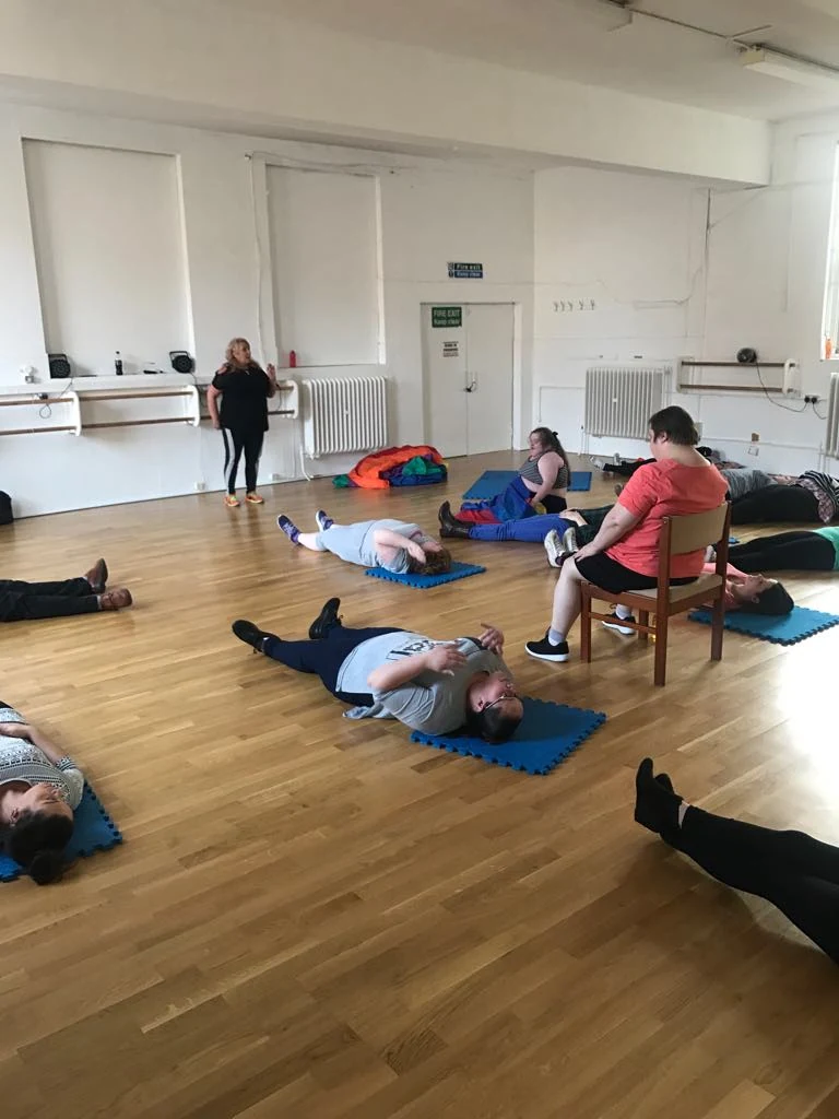 People taking part in floor-based exercise