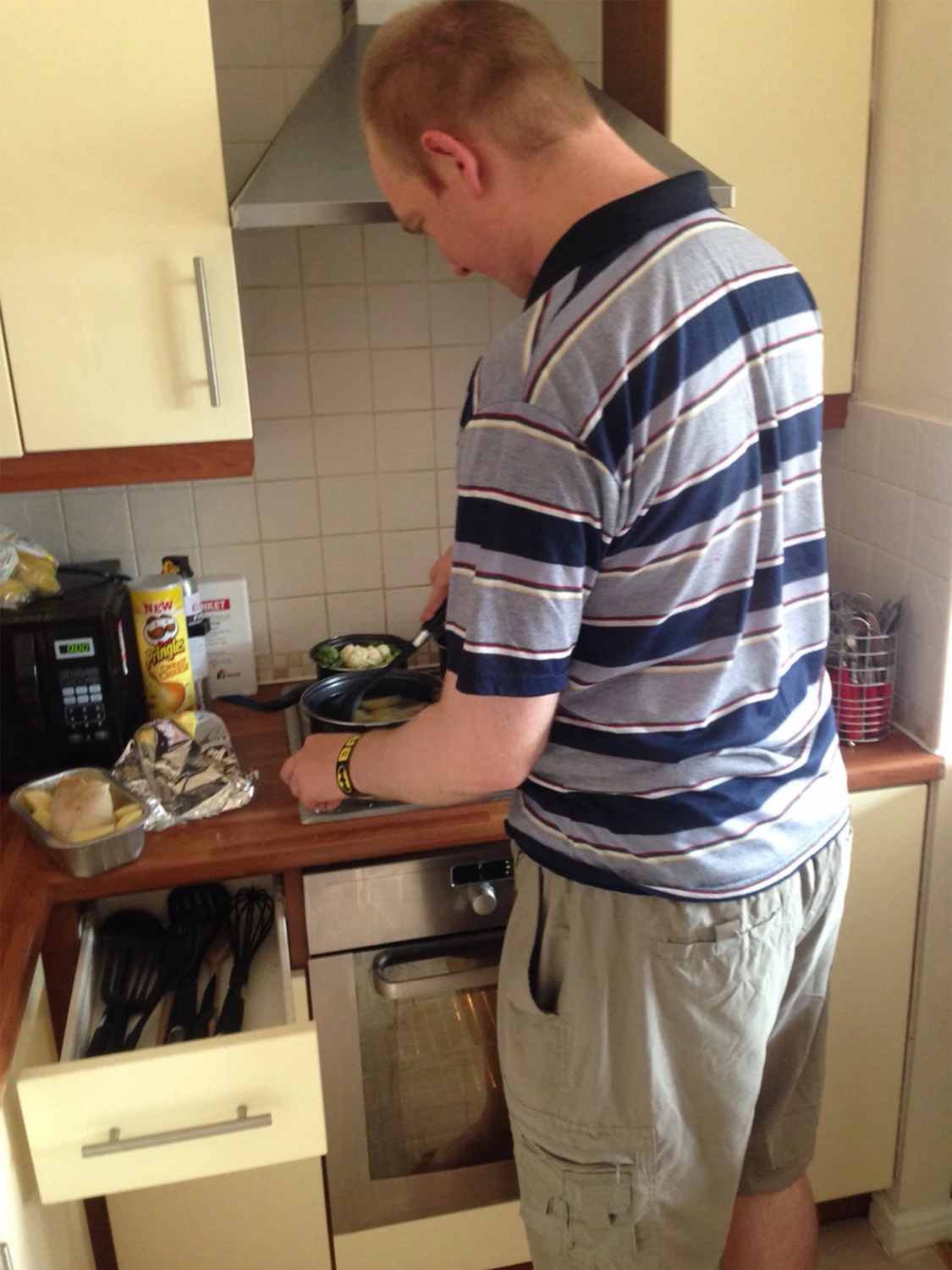 A man preparing food in a kitchen
