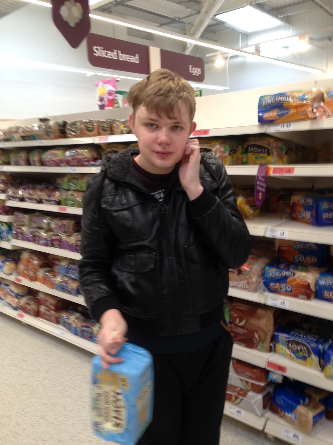 A man choosing groceries in a shop