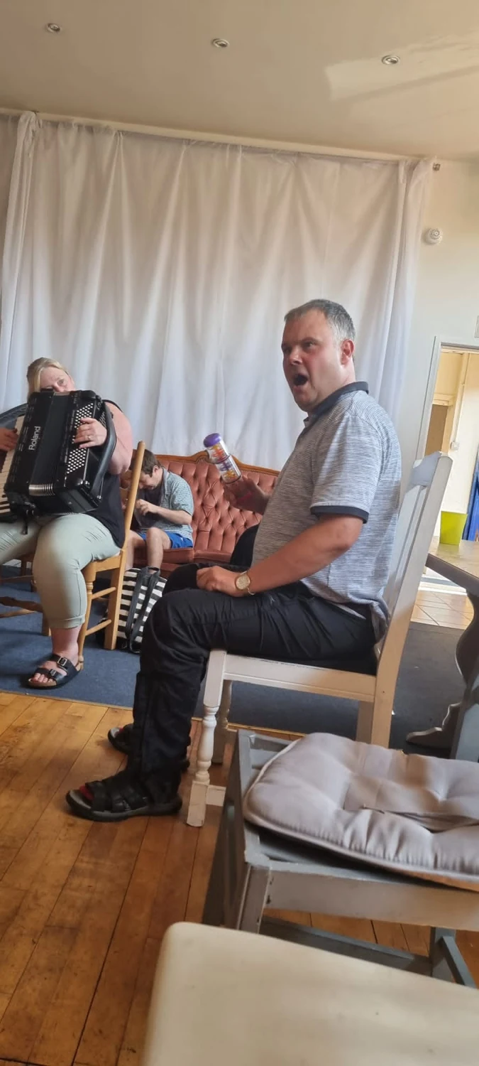 People chatting in a sitting room