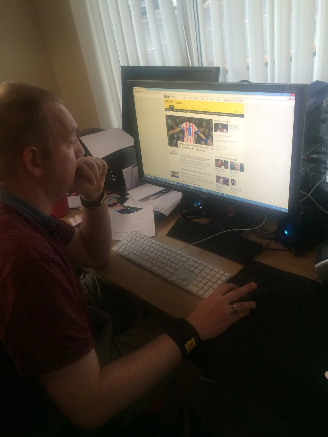 A man using a desktop computer