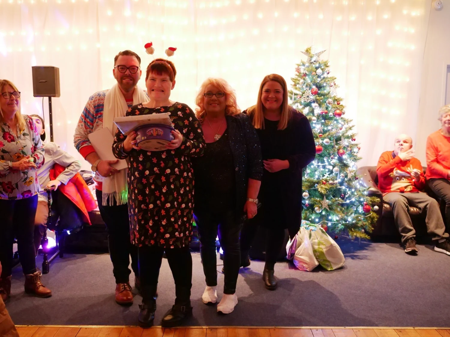A group posing together in festive outfits