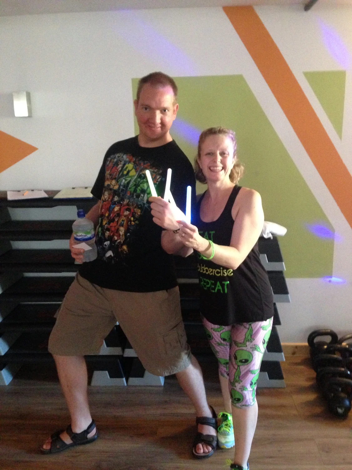 Two people posing in an activity room